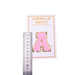 Pink chenille letter A patch with gold sequins and peel-and-stick adhesive backing