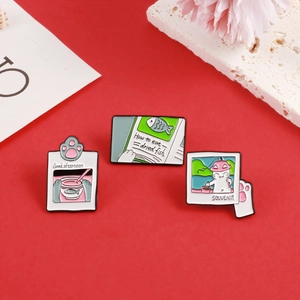Three cute cartoon cat enamel pins featuring fishing and tea time themes on a red background
