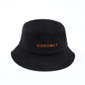 Close-up of black corduroy bucket hat with orange COCONUT embroidery detail