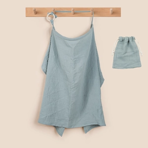 Detail of blue muslin cotton nursing cover and drawstring storage bag set with wood hanger