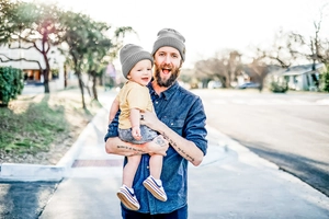 Detail of dark grey ribbed knit beanie set for parents and kids with warm textured finish