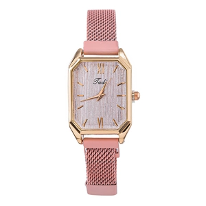 Square rose gold quartz watch with pink mesh strap and roman numerals on a sunburst dial
