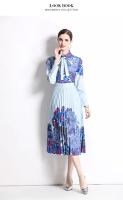 Detailed view of women's floral pleated skirt and shirt with elegant navy blue hydrangea print