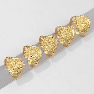 Adjustable golden stainless steel initial letter rings N O K L M in a row
