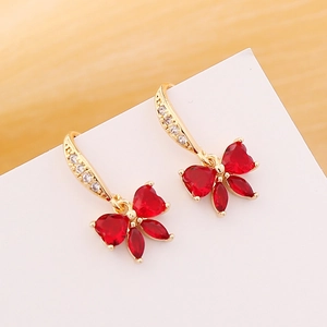 Elegant gold butterfly earrings with red heart stones and shimmering zircon accents