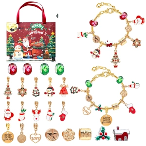 Detail of Christmas advent calendar with gold bracelets and 22 festive charms for kids