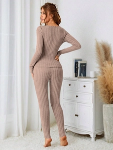 Detailed view of the ribbed knit texture and back fit of this dusty pink pajama set
