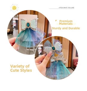 Detail view of blue mesh bow hair clips with faux gemstone and sparkling sequins