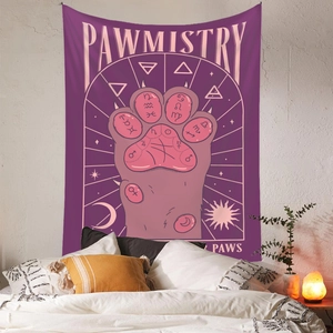 Close-up of bohemian purple tapestry with mystical pawmistry cat paw design on a bedroom wall