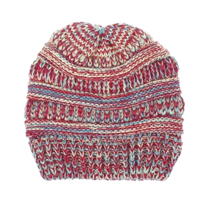 Detailed knit texture of a pink, blue, and white striped ponytail beanie for women