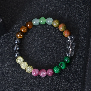 Macro shot of colorful tiger eye and malachite beads prosperity bracelet for luck
