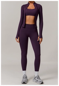 Detail of high-waisted seamless dark purple leggings with thumbhole jacket for yoga