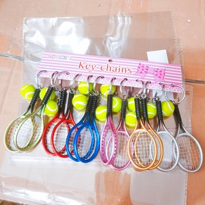 Detailed set of 12 tennis racket and ball keychains in assorted vibrant metallic colors