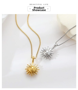 Detail of gold and silver sunburst pendant necklaces with box chain texture