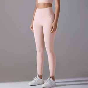 Close-up of high-waist pink yoga set showing slimming fit and premium athletic fabric