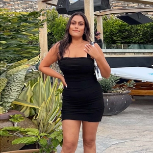 Sexy black bodycon mini dress with ruched detailing and slim fit spaghetti straps
