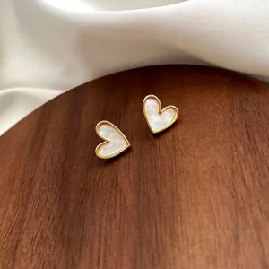 Elegant gold-framed heart stud earrings with natural white mother-of-pearl inlay
