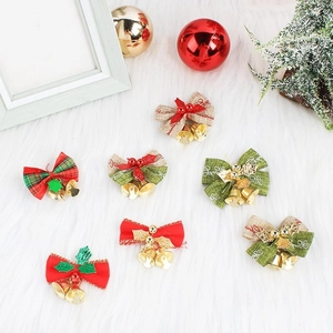 Close-up of decorative Christmas burlap bows with metal bells for festive gift wrapping