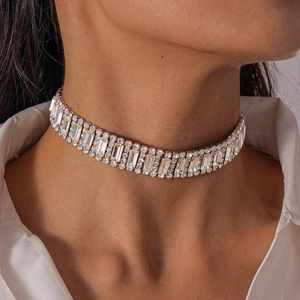 Close-up of a luxury silver-tone choker featuring multi-row geometric crystals and zircons