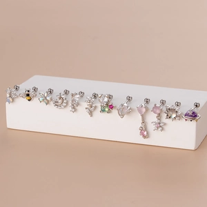 Detail view of assorted stainless steel stud earrings with colorful zircon stones