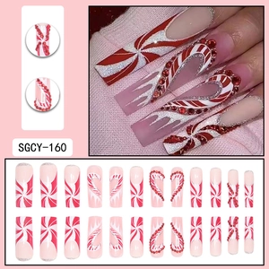 Christmas red candy cane press on nails with rhinestones and french heart design
