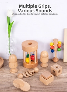 Detailed view of various wooden baby rattles and sensory toys for motor skill training