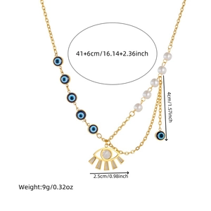 Detail of layered gold eye necklace with blue pendants, white pearls and size specifications