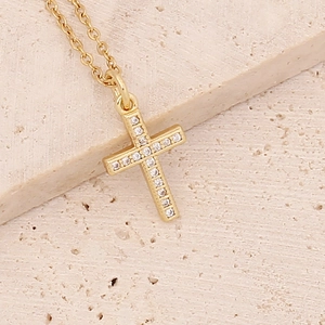 Close-up of 18K gold plated cross pendant with micro-pave cubic zirconia on an O-chain