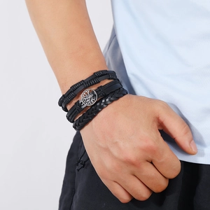 Men's multilayer black leather bracelet featuring a silver Tree of Life charm pendant