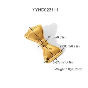 Golden butterfly bow hair clip in stainless steel with exact product dimensions and weight