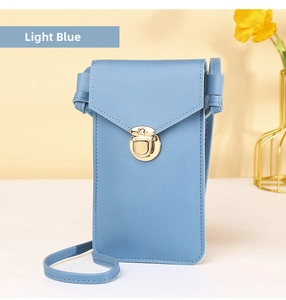 Detail view of light blue phone crossbody bag with gold twist lock and lychee leather texture