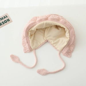 Pink knit winter baby bonnet with warm lining and leaf-shaped drawstring ties