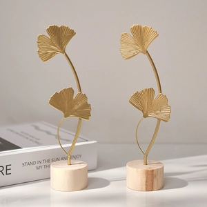 Modern gold ginkgo leaf metal ornaments with wooden base for luxury home decor