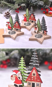 Detail of wooden star candle holder with Santa and metal cup for Christmas table decor