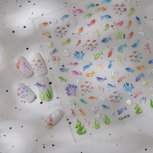 Colorful 3D tropical fish and coral ocean theme nail art stickers on white false nails