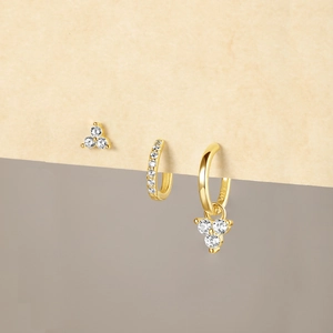 Macro detail of S925 sterling silver gold earrings set with zircon stones