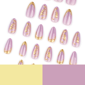 Sparkling purple cat eye almond press-on nails with gold foil accents and 3D wing patterns