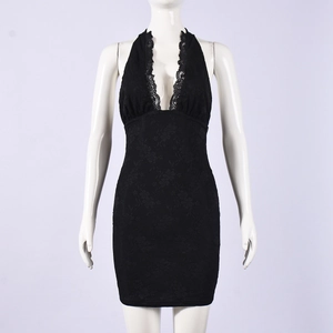 Close-up of deep V-neckline with floral lace trim on a black elastic mini dress
