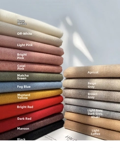 Detail view of neatly folded cashmere-like scarves in nineteen vibrant and elegant colors