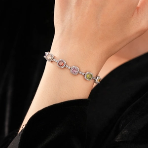 Macro detail of vintage zircon bracelet with multi-color gems and silver finish