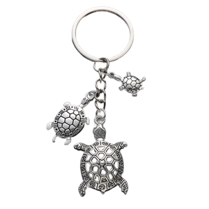 Antique silver sea turtle keychain featuring three hanging turtle charms on a metal ring