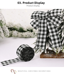 Close-up of black and white buffalo plaid Christmas ribbon with a DIY bow and pine branches
