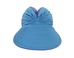 Detailed view of the blue sun visor hat featuring a pleated bow decoration and fabric texture