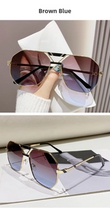 Detail der Polygon-Pilotensonnenbrille mit braun-blauen Verlaufsgläsern und Goldmetallrahmen