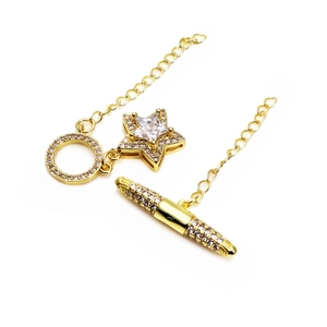 Macro shot of gold-plated brass OT toggle clasp with cubic zirconia star design