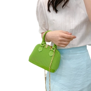 Green shell-shaped PVC jelly handbag for women featuring decorative colorful bubbles and chain