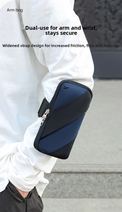 Close-up of sports arm bag showing mesh fabric texture and wide elastic strap detail