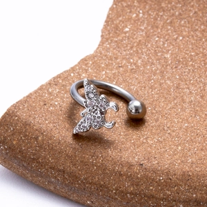 Macro shot of silver stainless steel C-ring featuring a micro-set zircon butterfly detail