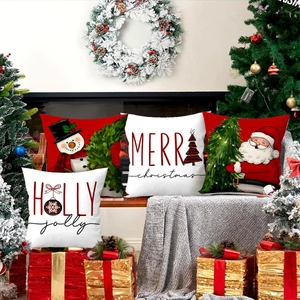 Detailed view of four festive Christmas pillow covers with Santa and snowman patterns