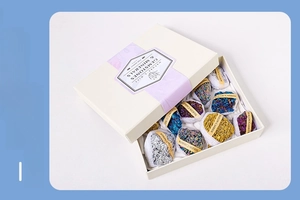 Macro view of multi-color silicon carbide crystal specimens in a white gift box